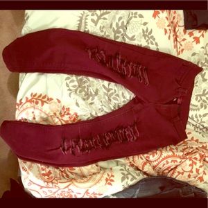 Burgundy rip jeans